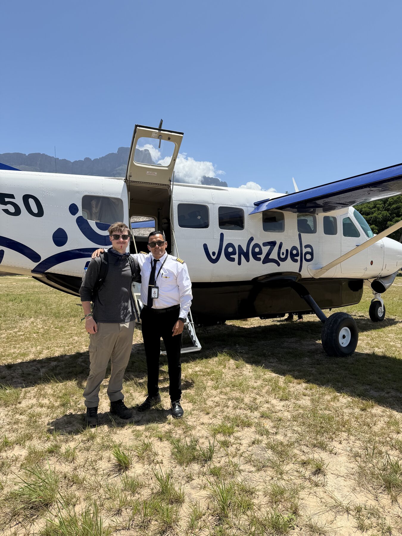 Benito beside a pilot and small plane in Gran Sabana