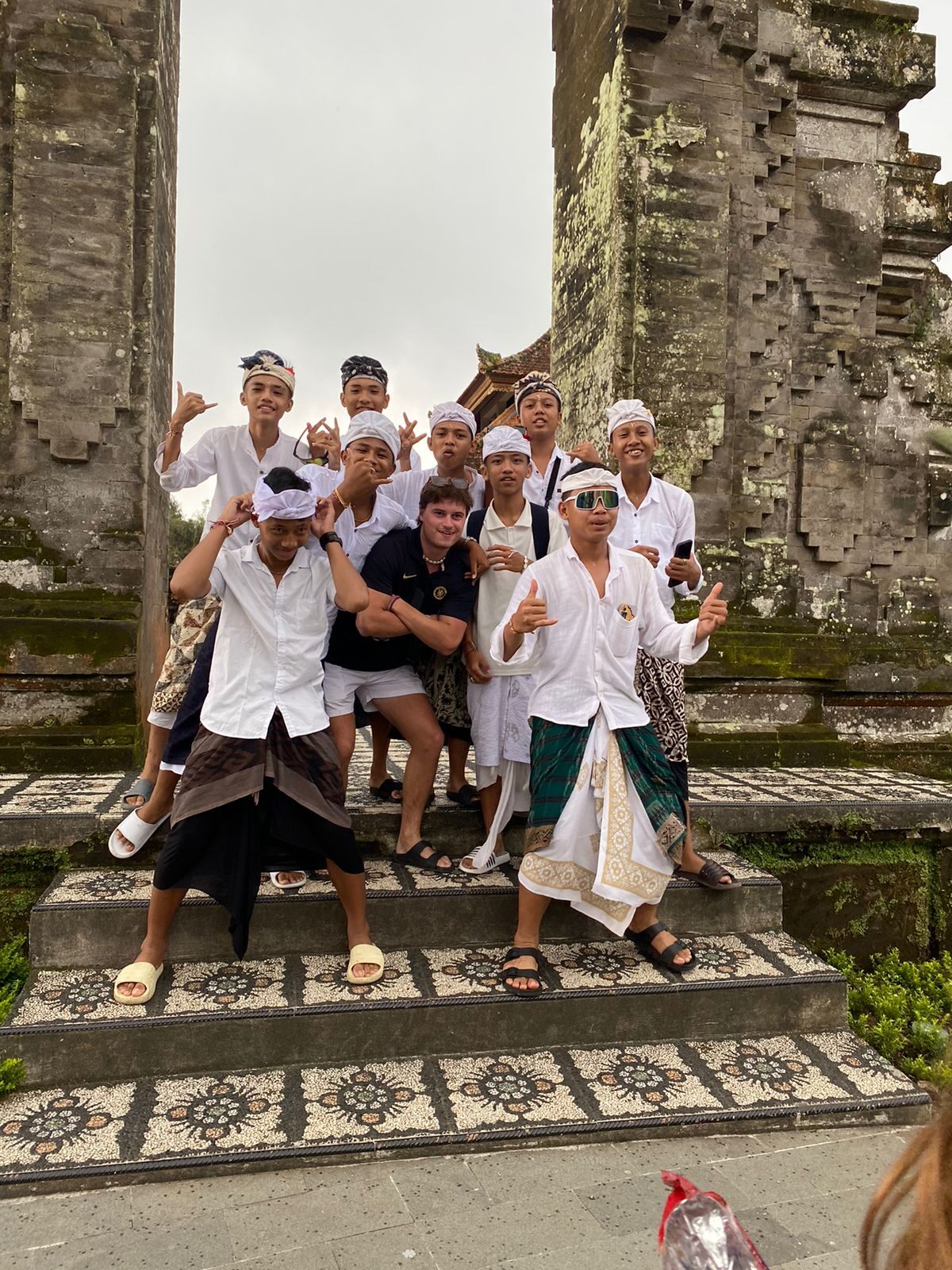 Benito with a local group at a temple in Indonesia