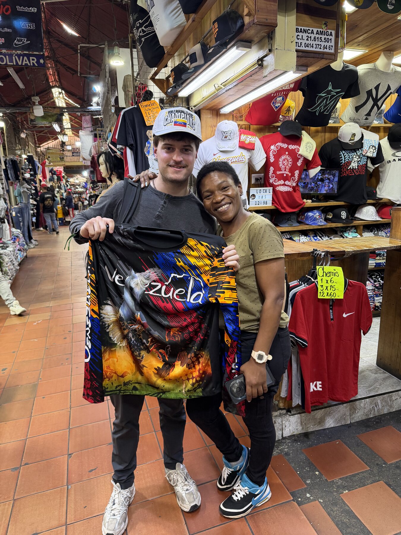 Benito with a vendor at a Venezuelan market